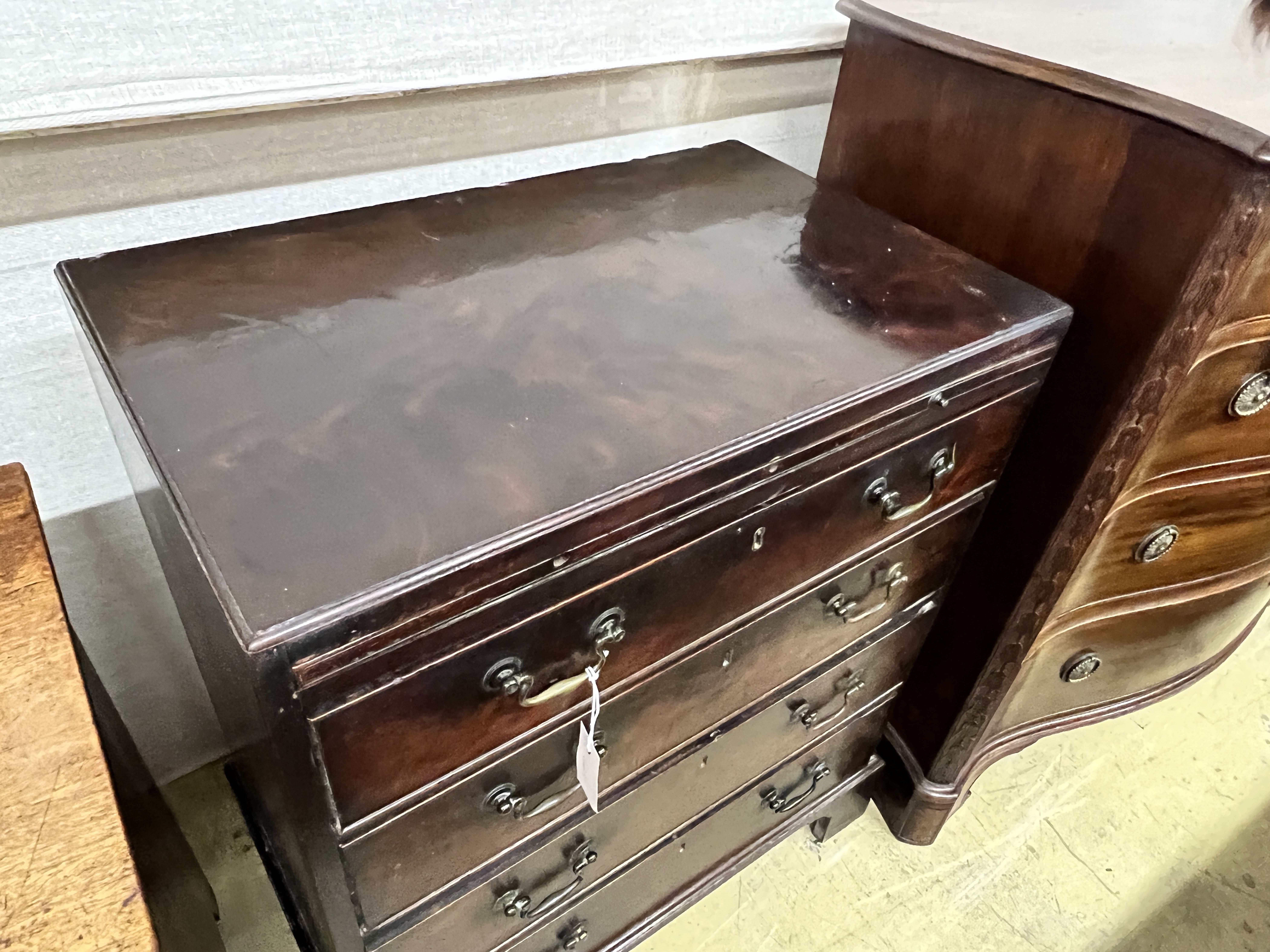 A small George III mahogany four drawer chest, fitted slide, width 71cm, depth 45cm, height 82cm